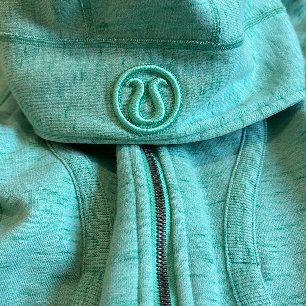 Teal colored scuba hoodie with enbroidered logo